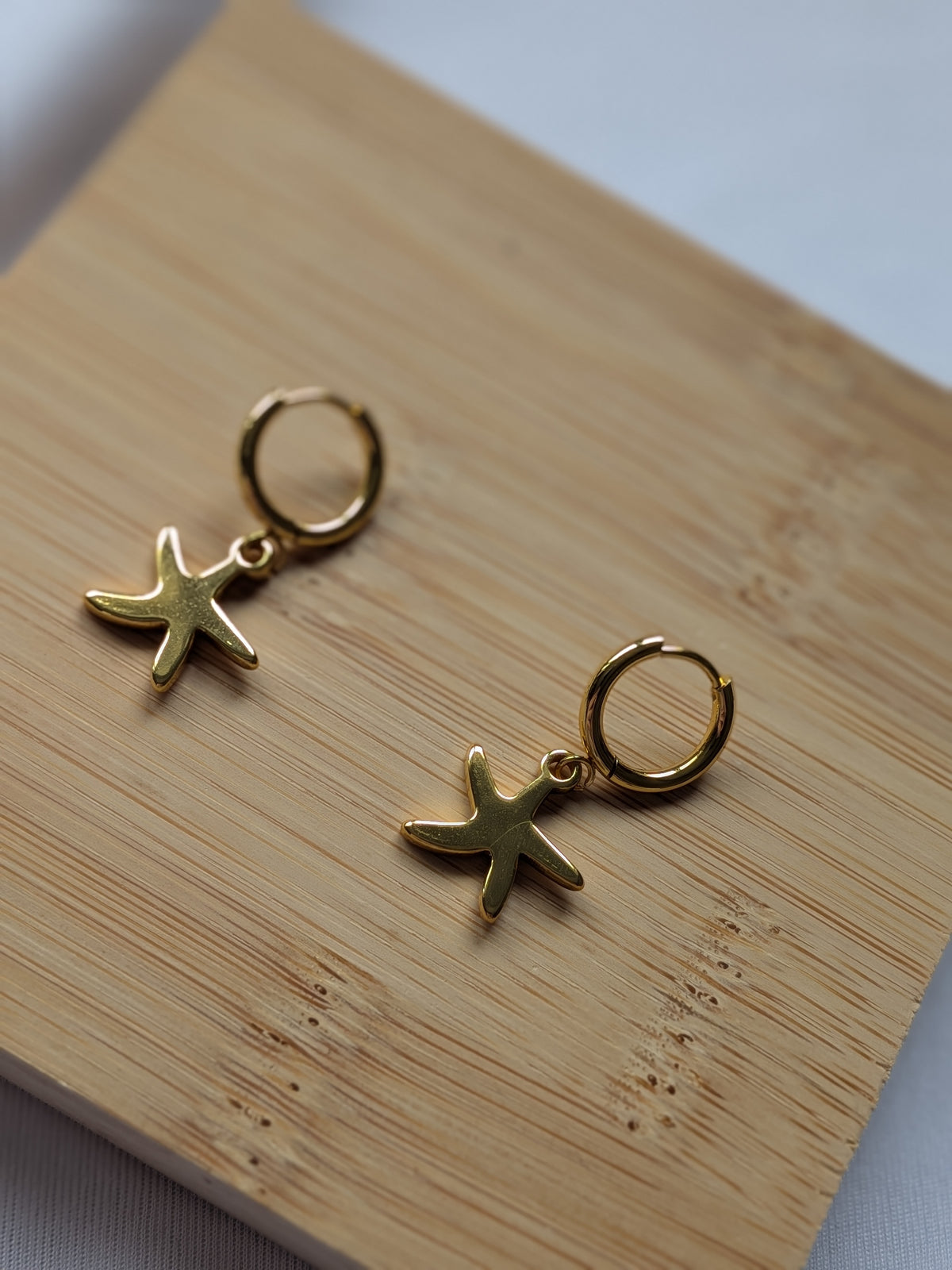 Boucle d'oreille étoile de mer dorée - acier inoxydable