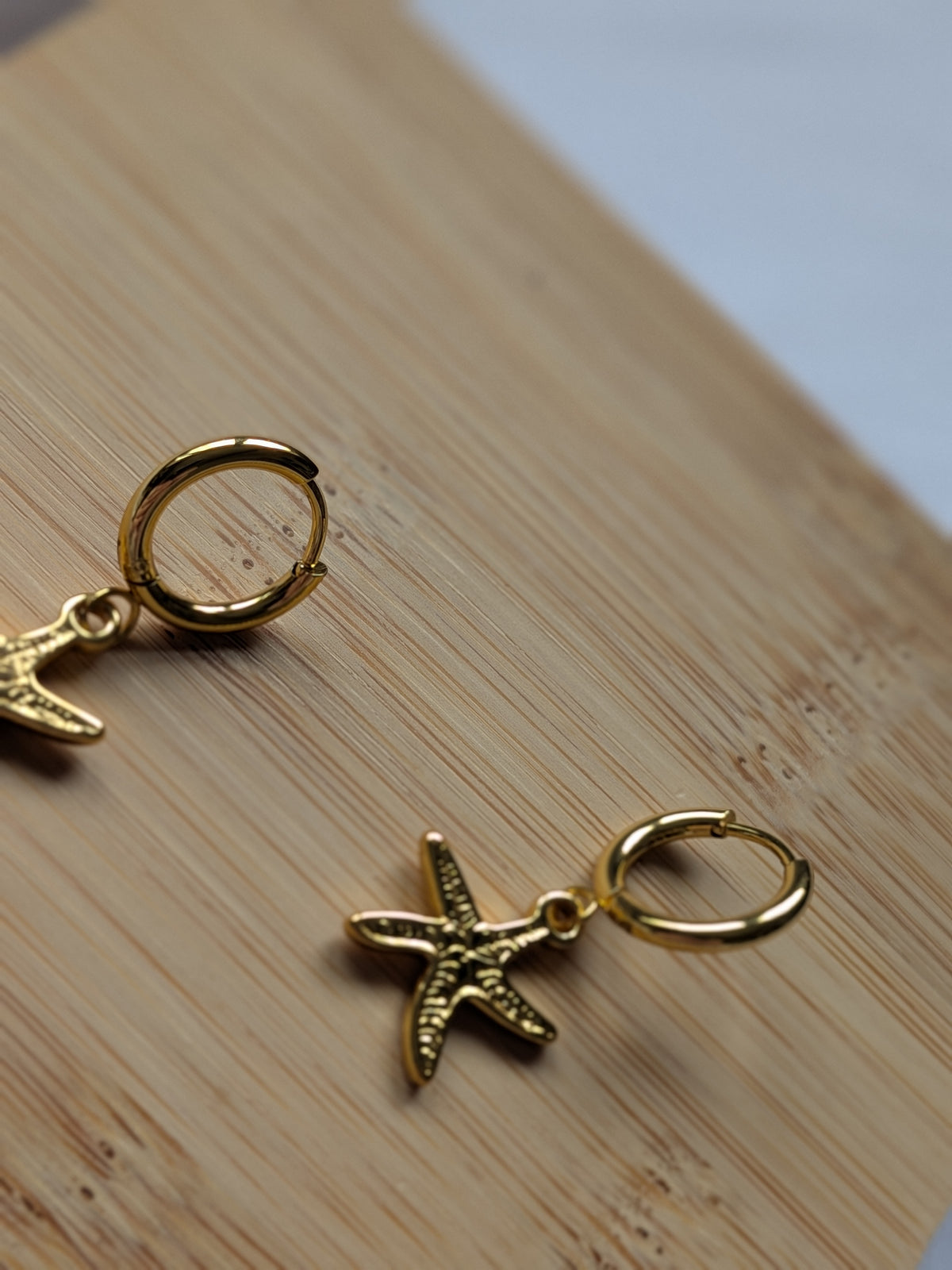 Boucle d'oreille étoile de mer dorée - acier inoxydable