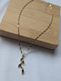 Collier fleur dorée chic en acier inoxydable