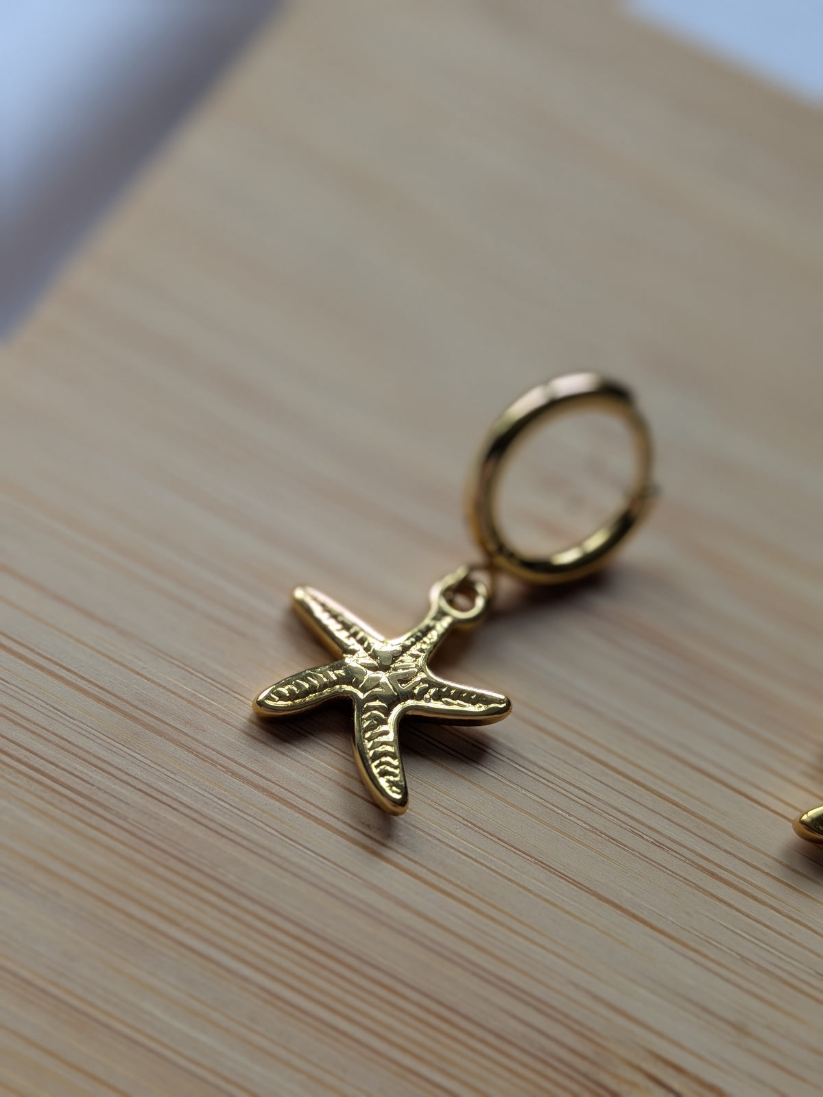 Boucle d'oreille étoile de mer dorée - acier inoxydable