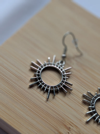 Boucle d'oreille soleile argentée