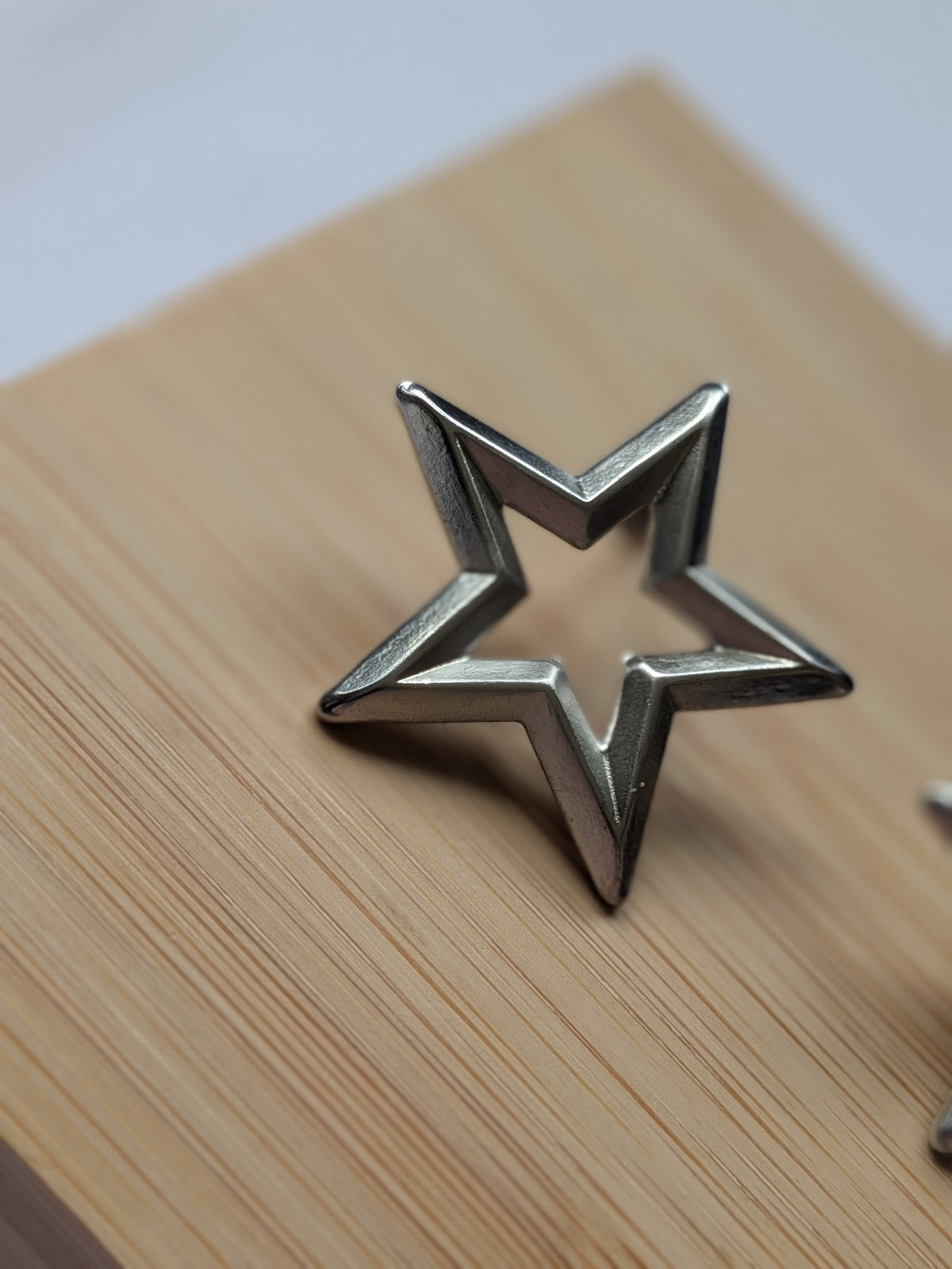 Boucle d'oreille étoile argentée - Acier inoxydable